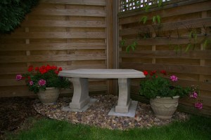 Stone Curved Seat & small planters.